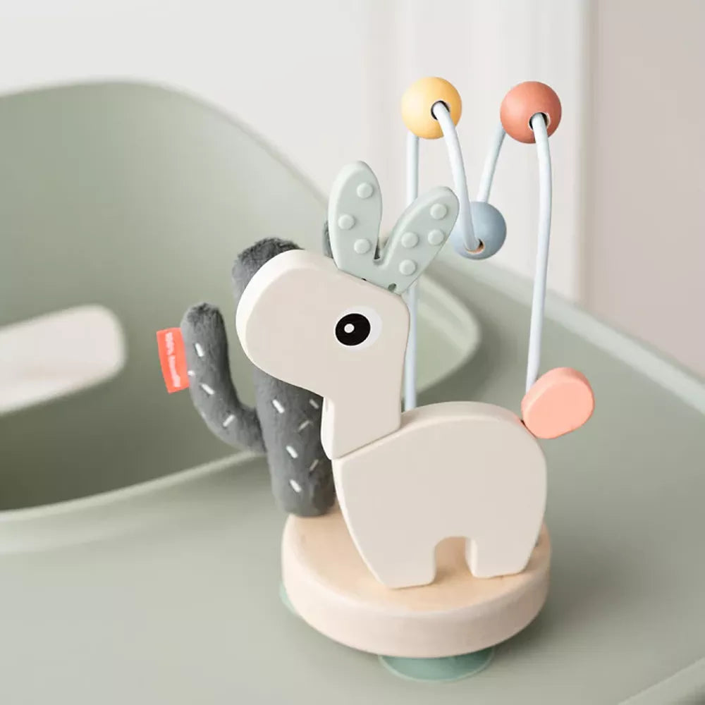 Gioco Multisensoriale con Ventosa Done by Deer attaccato al seggiolone