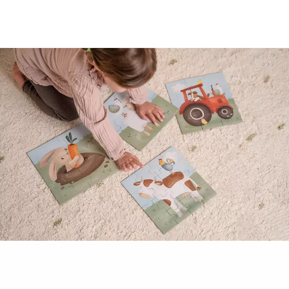 Puzzle 4 in 1 Little Dutch Little Farm bambino che gioca con i puzzle